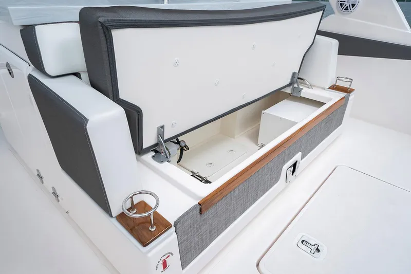 Slide: The Image of Manufacturer Provided Image: 2021 Tiara Sport 34 LS boat with open storage compartment. - 13