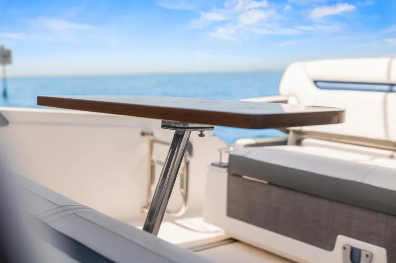 Slide: The Image of Luxury seating area on 2021 Tiara Sport 34 LS boat with ocean view. - 24