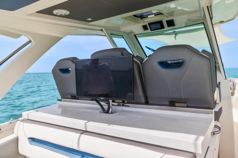 Slide: The Image of 2021 Tiara Sport 34 LS boat interior with seating and ocean view. - 25