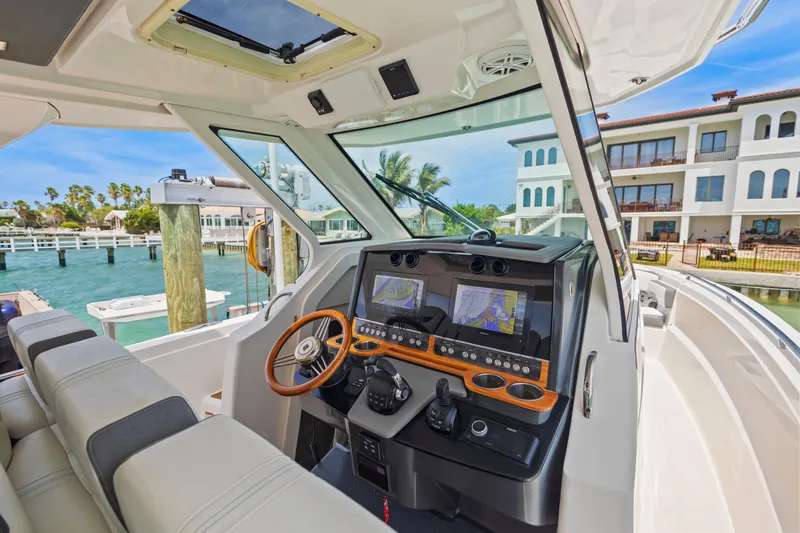 Slide: The Image of Interior view of 2021 Tiara Sport 34 LS boat with modern navigation system. - 27