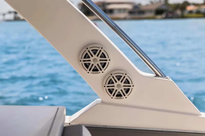 Slide: The Image of 2021 Tiara Sport 34 LS boat speakers with ocean view in background. - 35