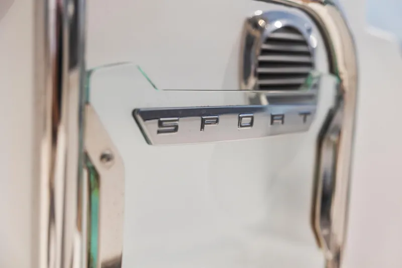 Slide: The Image of Close-up of 2021 Tiara Sport 34 LS emblem on a sleek metallic surface. - 38