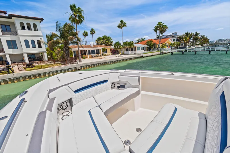 Slide: The Image of Luxurious 2021 Tiara Sport 34 LS boat docked near waterfront homes. - 40