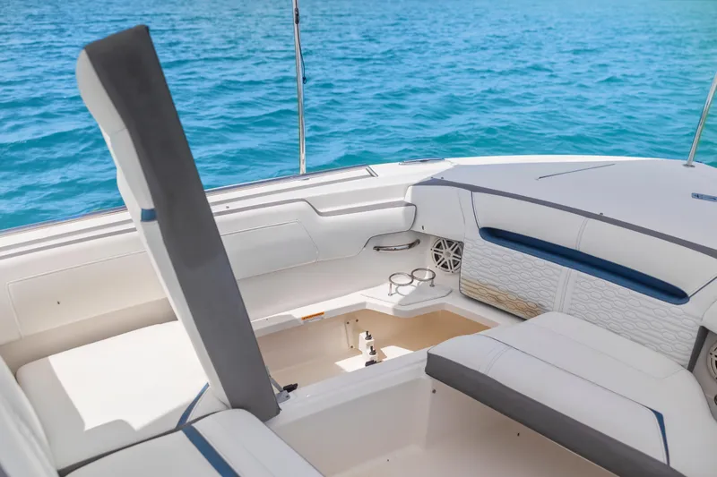 Slide: The Image of 2021 Tiara Sport 34 LS boat interior with white seating and ocean backdrop. - 41