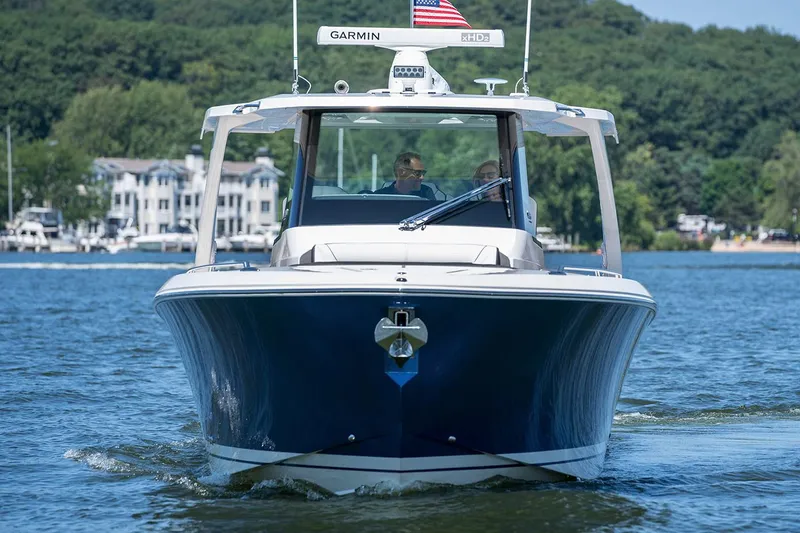 Slide: The Image of Manufacturer Provided Image: 2021 Tiara Sport 34 LS boat cruising on a lake with scenic background. - 5