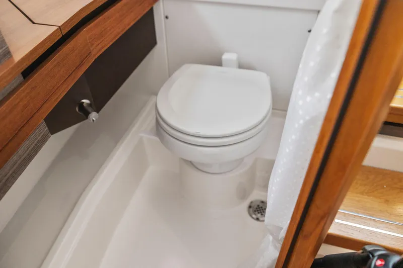 Slide: The Image of Compact bathroom in 2021 Tiara Sport 34 LS boat with modern fixtures. - 52