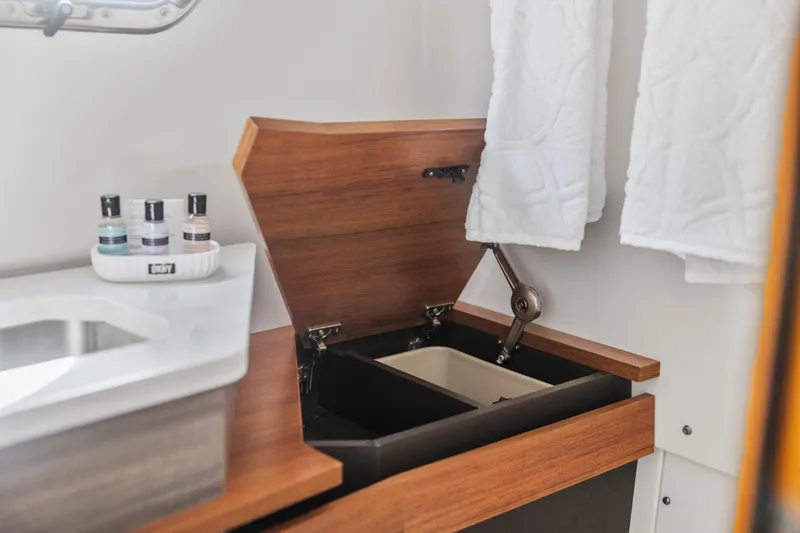 Slide: The Image of Luxury bathroom interior of 2021 Tiara Sport 34 LS boat with wooden accents. - 60