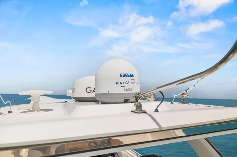 Slide: The Image of 2021 Tiara Sport 34 LS boat with TracVision satellite system on deck. - 67