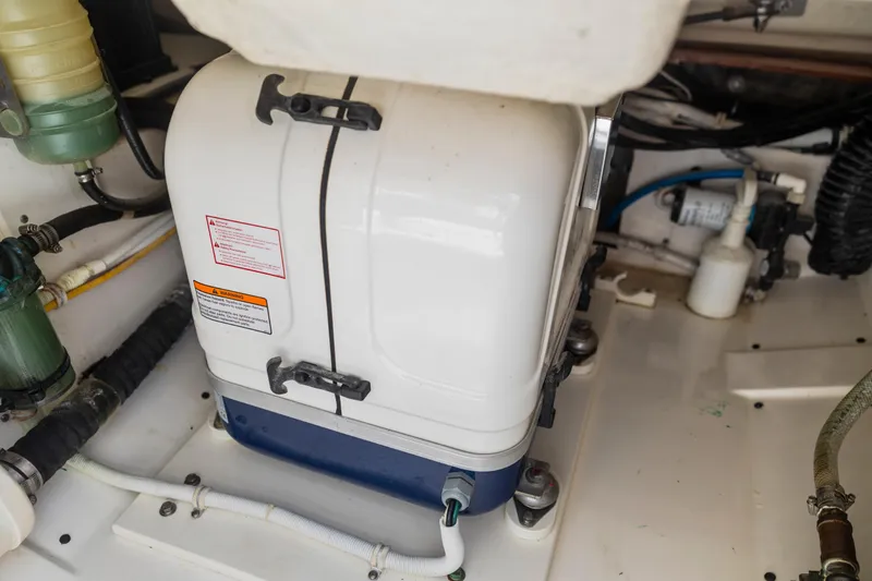 Slide: The Image of Engine compartment of a 2021 Tiara Sport 34 LS boat, showcasing mechanical components. - 68