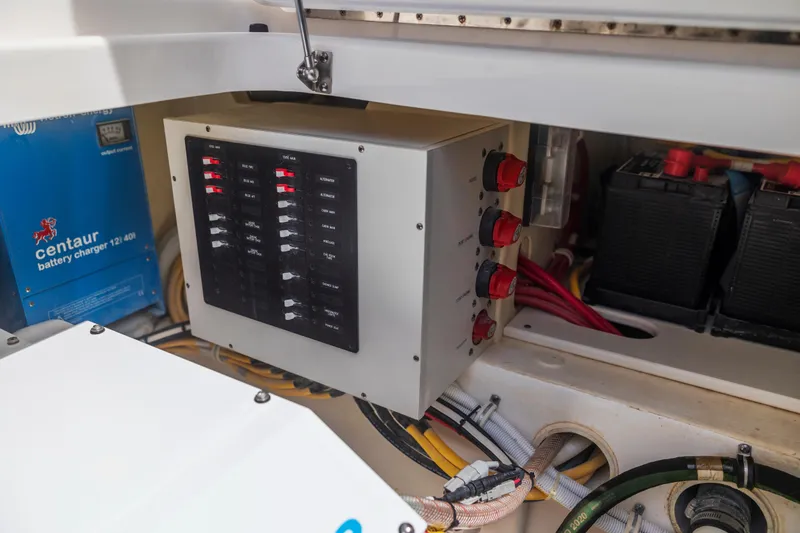 Slide: The Image of Electrical panel and battery charger in 2021 Tiara Sport 34 LS boat. - 70