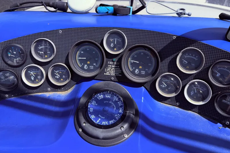 Slide: The Image of Dashboard of a 1987 Sea Ray 340 Sedan Bridge with various gauges and instruments, close up - 16