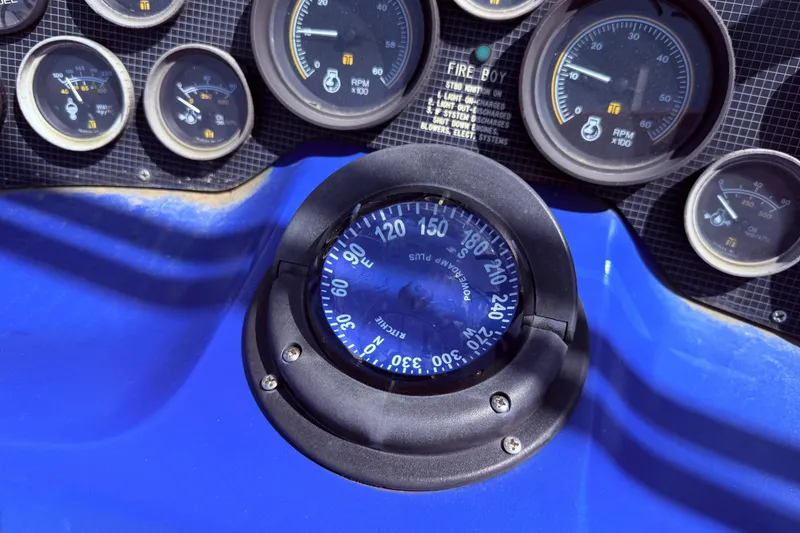 Slide: The Image of Dashboard of a 1987 Sea Ray 340 Sedan Bridge with gauges and compass. - 17