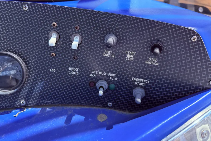 Slide: The Image of Control panel of a 1987 Sea Ray 340 Sedan Bridge boat with switches and gauges. - 19