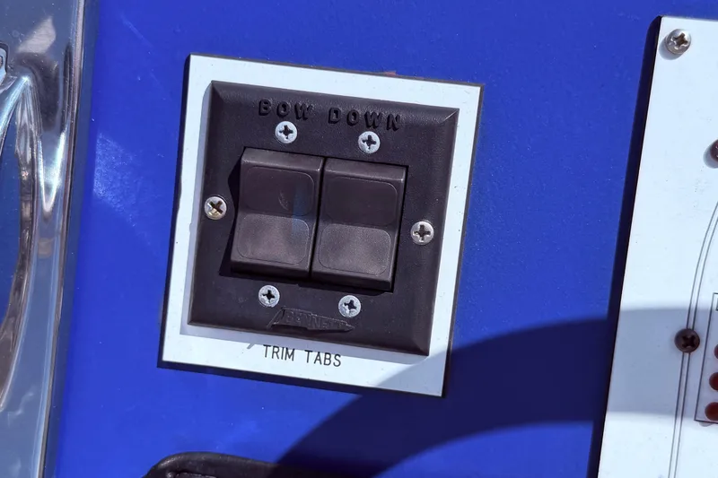 Slide: The Image of Control panel for trim tabs on a 1987 Sea Ray 340 Sedan Bridge boat. - 20