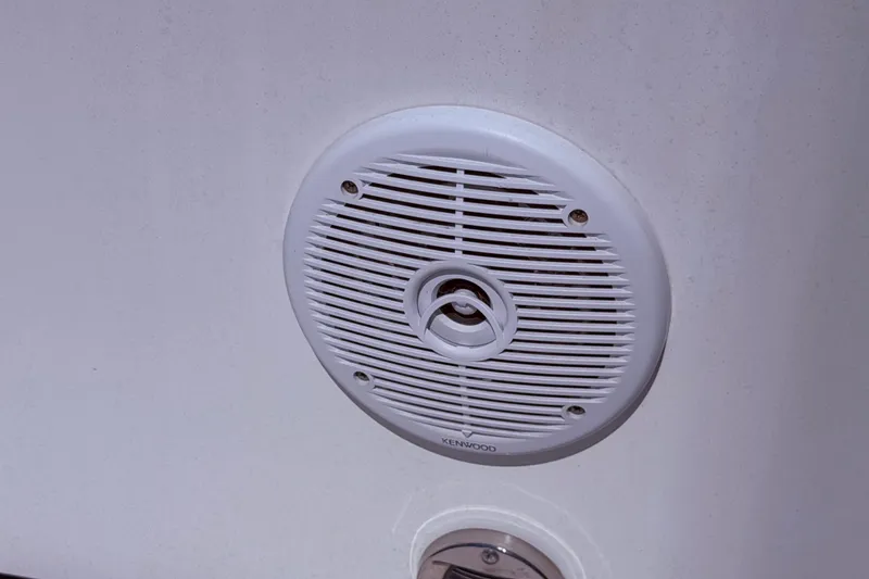 Slide: The Image of White Kenwood speaker on 1987 Sea Ray 340 Sedan Bridge boat interior. - 23