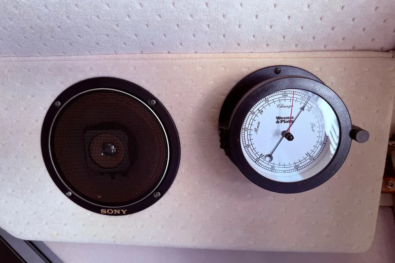 Slide: The Image of Sony speaker and barometer on 1987 Sea Ray 340 Sedan Bridge. - 34