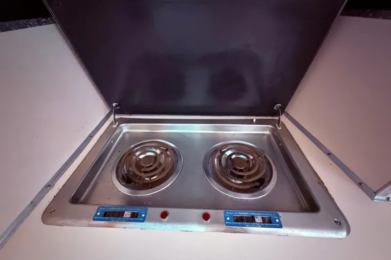 Slide: The Image of Electric stove in 1987 Sea Ray 340 Sedan Bridge yacht kitchen. - 44