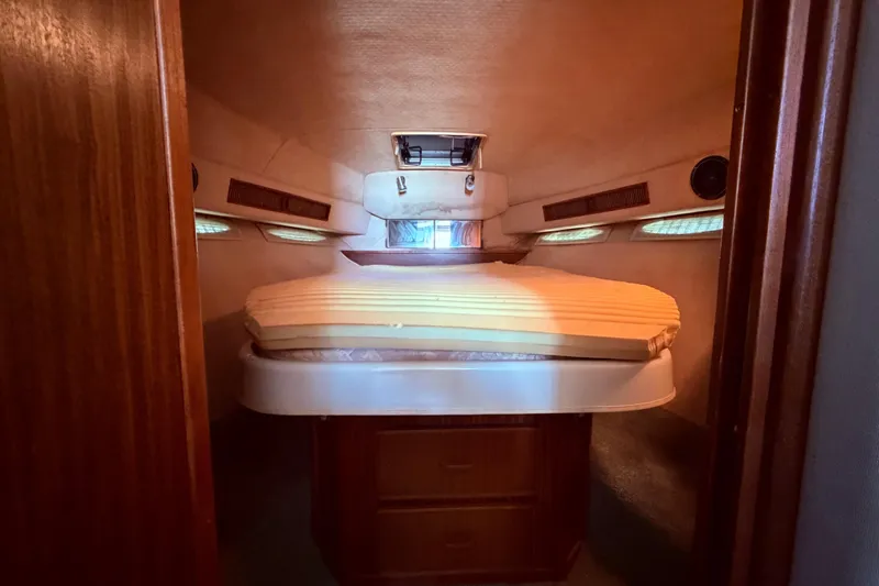 Slide: The Image of Interior cabin of 1987 Sea Ray 340 Sedan Bridge with double walk around bed and ample storage - 52