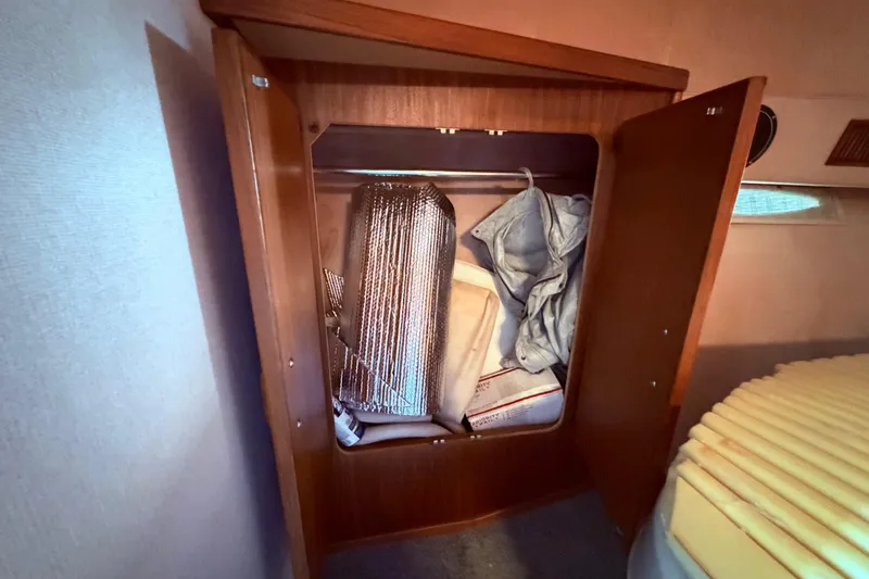 Slide: The Image of 1987 Sea Ray 340 Sedan Bridge boat, storage closet in the v berth - 55
