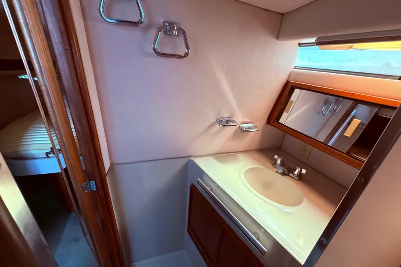 Slide: The Image of 1987 Sea Ray 340 Sedan Bridge bathroom vanity, view from the shower - 63