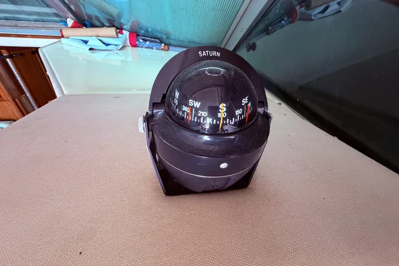 Slide: The Image of Compass on 1987 Sea Ray 340 Sedan Bridge boat dashboard. - 65