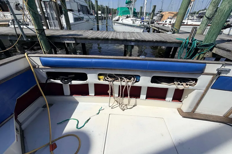 Slide: The Image of 1987 Sea Ray 340 Sedan Bridge boat interior with docked marina view. - 9