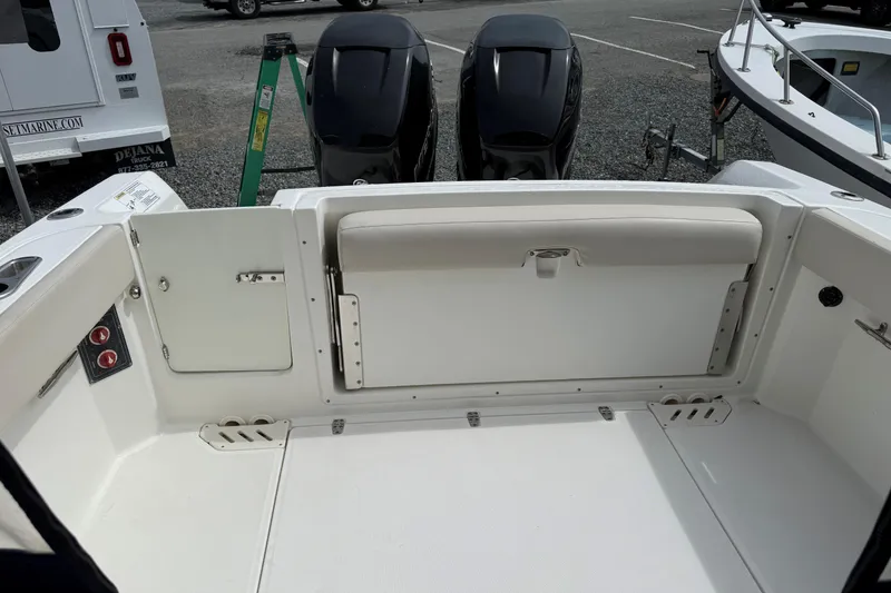 Slide: The Image of 2015 Boston Whaler 270 Vantage boat interior with seating and storage compartments. - 10