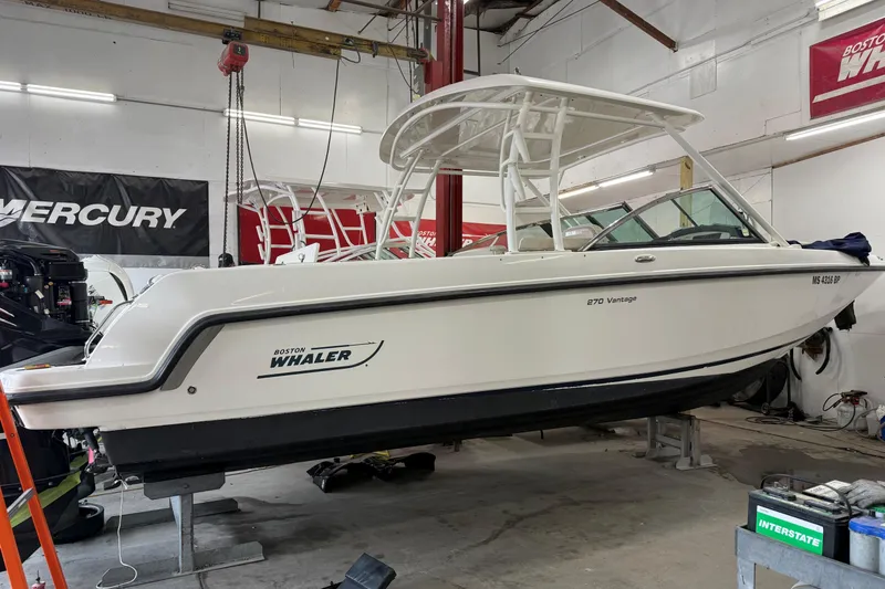 Slide: The Image of 2015 Boston Whaler 270 Vantage boat in a workshop setting. - 4