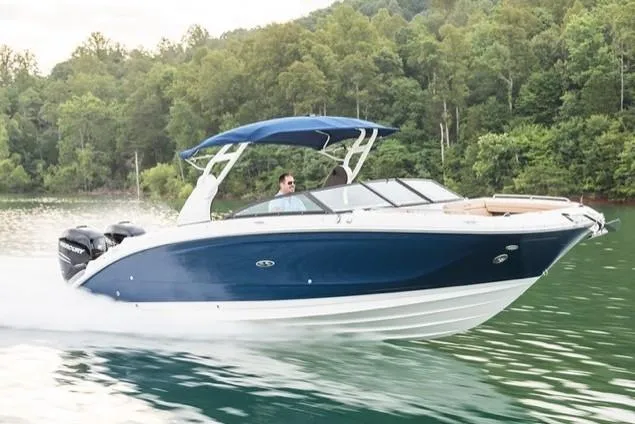 The Image of Manufacturer Provided Image: 2019 Sea Ray SDX 290 Outboard cruising on a lake with lush green forest background. - 0