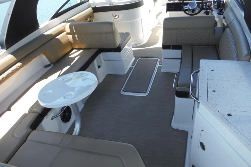 Slide: The Image of Luxurious interior of 2019 Sea Ray SDX 290 Outboard boat with seating and table. - 11