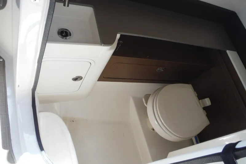 Slide: The Image of 2019 Sea Ray SDX 290 Outboard boat interior with compact bathroom amenities. - 19
