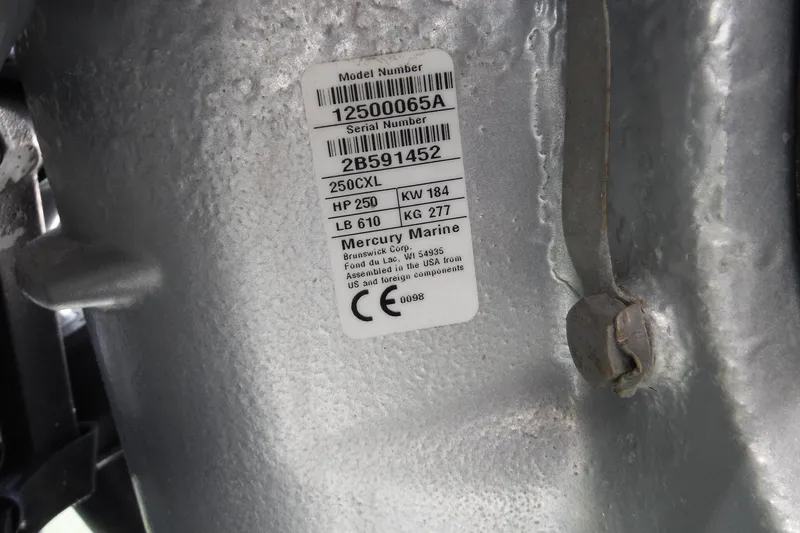Slide: The Image of Label on Mercury Marine engine, showing model and serial numbers, horsepower, and weight details. - 31