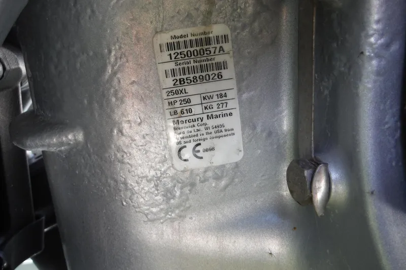 Slide: The Image of Close-up of a 2019 Sea Ray SDX 290 Outboard engine serial number label. - 32