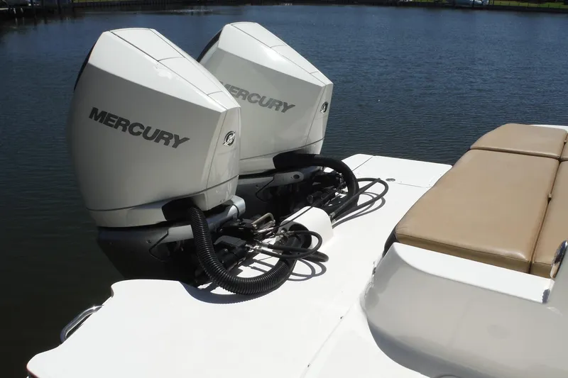 Slide: The Image of 2019 Sea Ray SDX 290 Outboard with twin Mercury engines on a calm lake. - 8