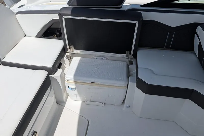 Slide: The Image of Interior of 2021 Monterey 255SS Super Sport boat with seating and cooler storage. - 12