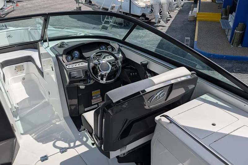 Slide: The Image of 2021 Monterey 255SS Super Sport boat interior with steering wheel and dashboard. - 13