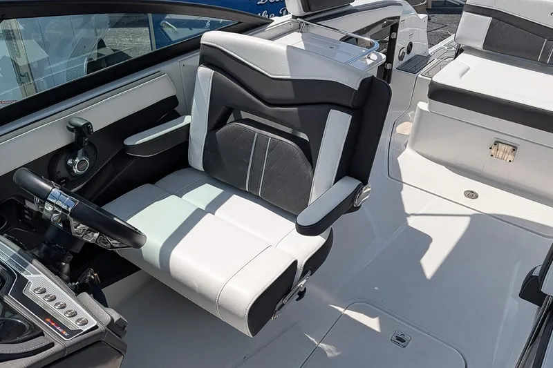 Slide: The Image of 2021 Monterey 255SS Super Sport boat interior with sleek seating and modern controls. - 14