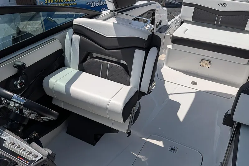 Slide: The Image of Interior of a 2021 Monterey 255SS Super Sport boat with modern seating and controls. - 15