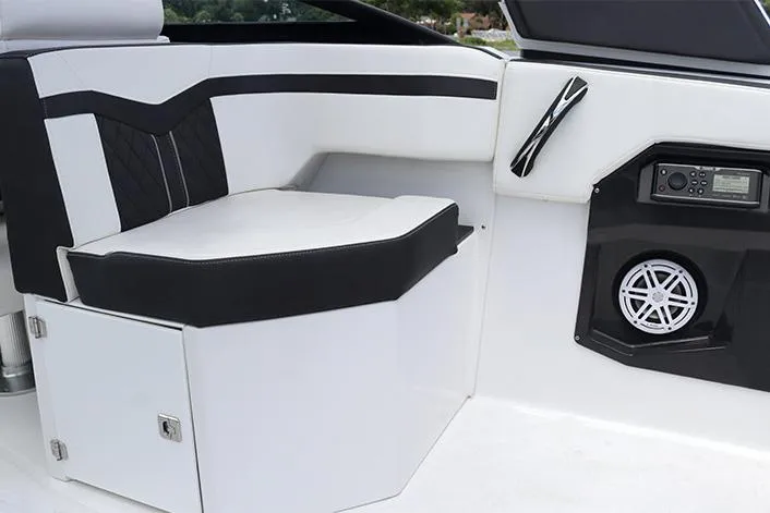 Slide: The Image of Manufacturer Provided Image: Interior of 2021 Monterey 255SS Super Sport boat with black and white seating and audio system. - 28