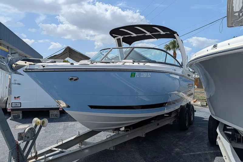 Slide: The Image of 2021 Monterey 255SS Super Sport boat on trailer under blue sky. - 3