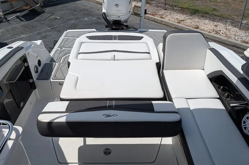Slide: The Image of 2021 Monterey 255SS Super Sport boat interior with white seating and cup holders. - 8
