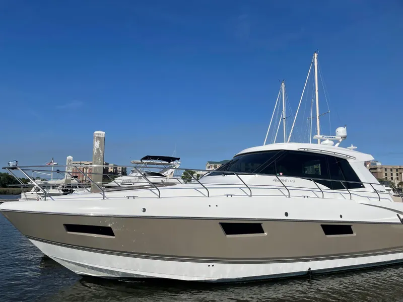The Image of 2012 Cruisers Yachts 48 Cantius on water, clear sky background. - 0
