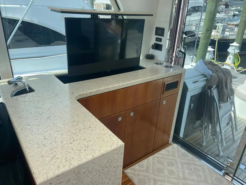 Slide: The Image of Interior of 2012 Cruisers Yachts 48 Cantius with TV and countertop. - 5