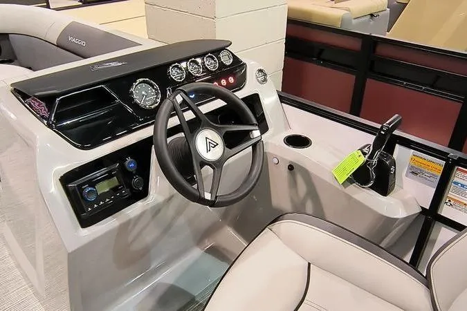 Slide: The Image of 2026 Viaggio V22U boat dashboard with steering wheel and control panel. - 2