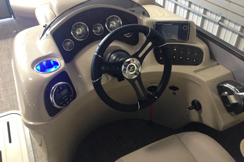 Slide: The Image of 2016 Misty Harbor 2285 Biscayne Bay RL boat dashboard with steering wheel and controls. - 11