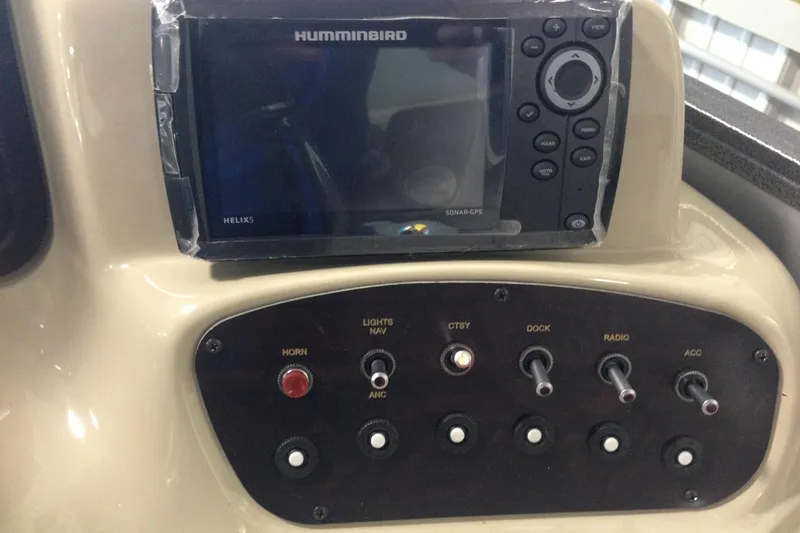 Slide: The Image of Control panel of a 2016 Misty Harbor 2285 Biscayne Bay RL with Humminbird sonar GPS. - 12
