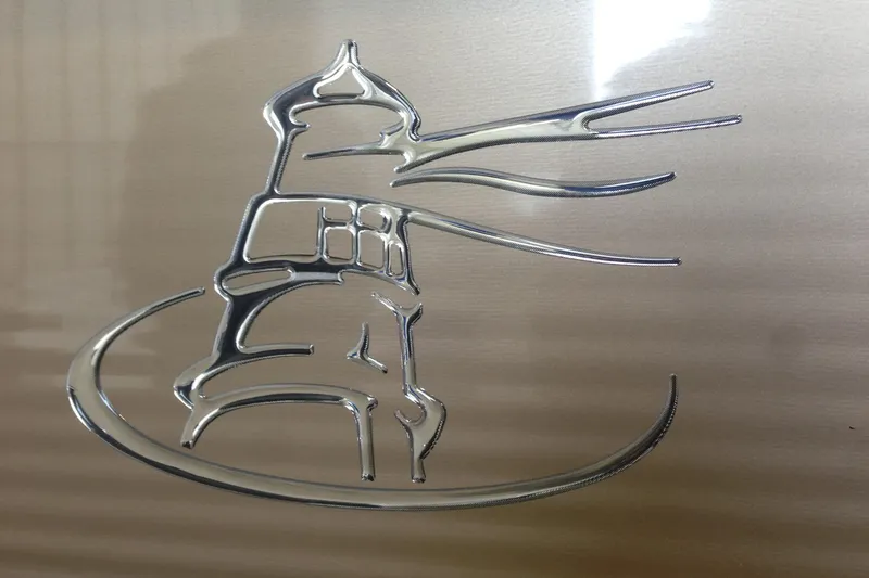 Slide: The Image of Silver lighthouse emblem on Misty Harbor 2016 Biscayne Bay RL boat. - 9