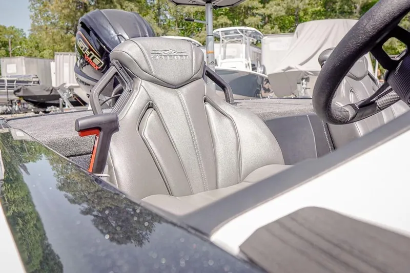 Slide: The Image of 2026 Skeeter ZXR20 SE boat interior with sleek seating and steering wheel. - 14