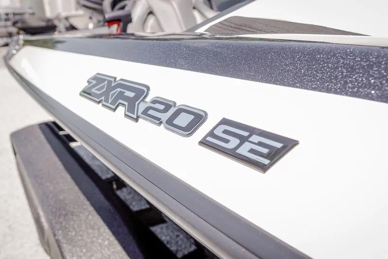 Slide: The Image of 2026 Skeeter ZXR20 SE boat logo on sleek white surface. - 16