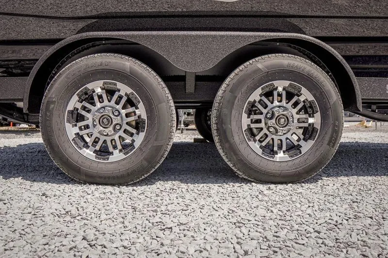 Slide: The Image of Dual wheels of a 2026 Skeeter ZXR20 SE on gravel surface. - 17